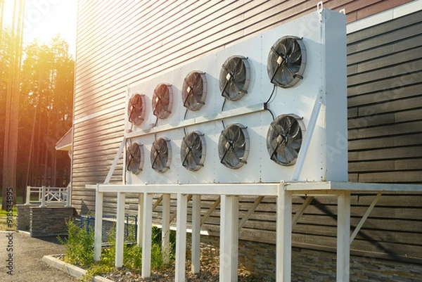 Obraz Air conditioning outdoor unit installed outside the building. Air fans of the HVAC system.