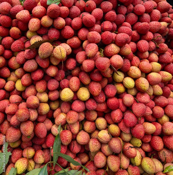 Obraz Ripe lychees, ready for sale at the market. Vibrant colors and juicy sweetness of this tropical delight, straight from the orchard to your table. Lychee, Litchi, Lichee, fruit