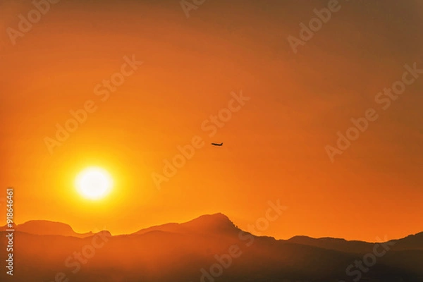 Fototapeta View of a plane taking off AT SUNSET from Arenal beach, between Llucmajor and Palma de Mallorca, Balearic Islands, Spain.