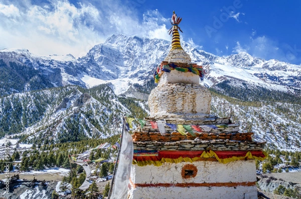 Obraz Old Buddhist stupa near the village of Braga with the Annapurny III (7555m.) in the background, Annapurna Circuit Trek, Nepal