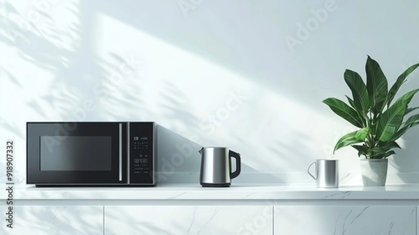 Fototapeta A minimalist kitchen in cool white tones with a white countertop, a black microwave, a gray kettle, a silver mug, and a green plant, featuring a clean and serene atmosphere