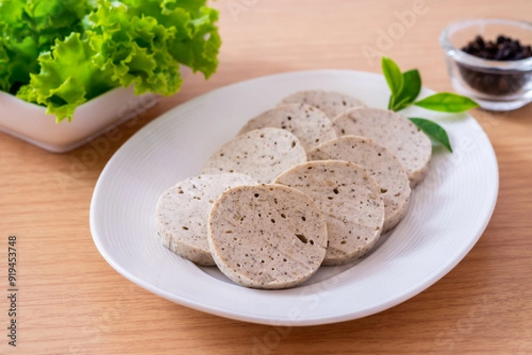 Fototapeta Vietnamese pork sausage or white pork sausage on white plate.