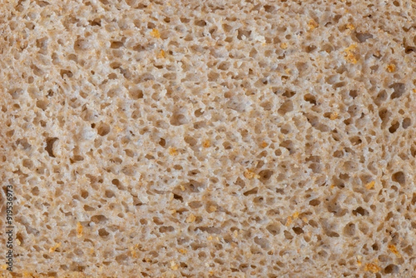Obraz A piece of black bread, close-up. Porous texture of yeast bread.