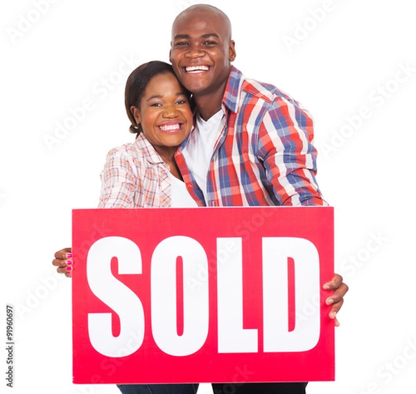 Fototapeta african couple showing sold sign
