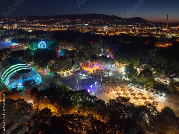 Fototapeta 08.11.24. Budapest, Hungary. Aerial view about the Sziget festival in Budapest. This is the largest festival in Hungary every year. There is Concerts, talk shows, parties, camping etc.