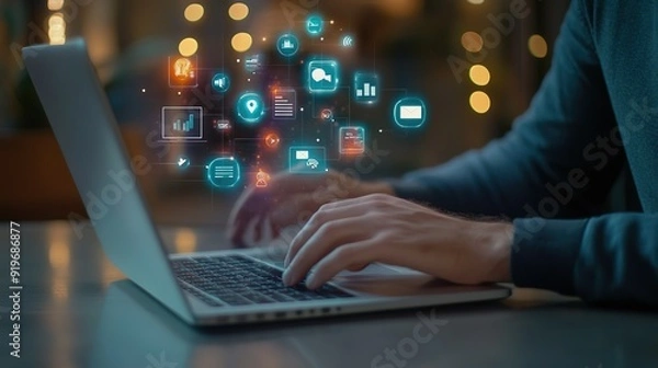 Fototapeta A laptop with a man typing on it