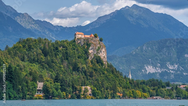 Fototapeta The famous and beautiful lake Bled with it’s signature small Bled Island with in the background Bled Castle on the high cliff, Bled, Slovenia