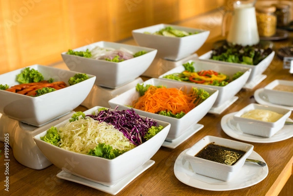 Obraz Salad bar with a variety of vegetables served buffet.