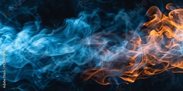 Fototapeta Dynamic blue and orange swirling smoke creates an intriguing visual contrast that mesmerizes viewers