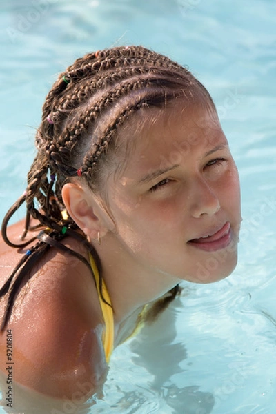 Obraz portrait of the sunburnt girl which sits in water for shoulders