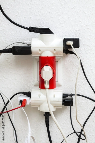Obraz Multiple electrical plugs in wall outlet
