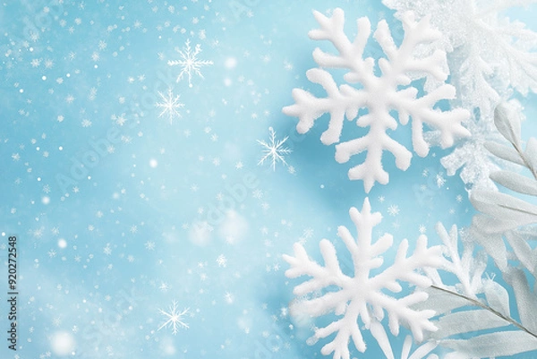 Fototapeta White snowflakes delicately floating on a light blue background, representing the beauty of winter and the purity of snow, with a calm and peaceful ambiance.