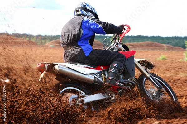 Obraz Off-road motorbike extreme cornering.