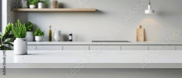 Fototapeta Blurred white kitchen interior with empty countertop for product display, blurred background