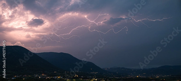 Obraz Panorama of a long branched lightning bolt over the Italian Alps, north of Verona, Italy