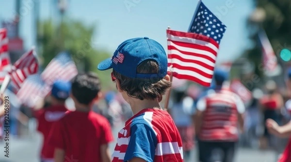 Fototapeta A patriotic celebration with people waving American flags, wearing red, white, and blue attire, and participating in a parade, capturing the essence of national pride and community spirit