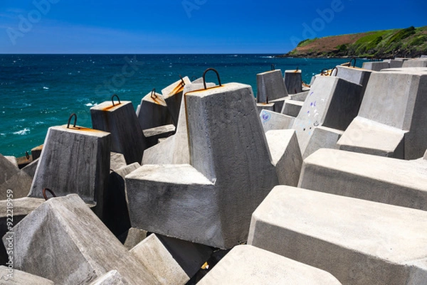 Fototapeta stone blockades on wharf at coffs harbour in australia
