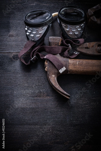 Fototapeta vertical view vintage tools goggles hammer pliers clamp