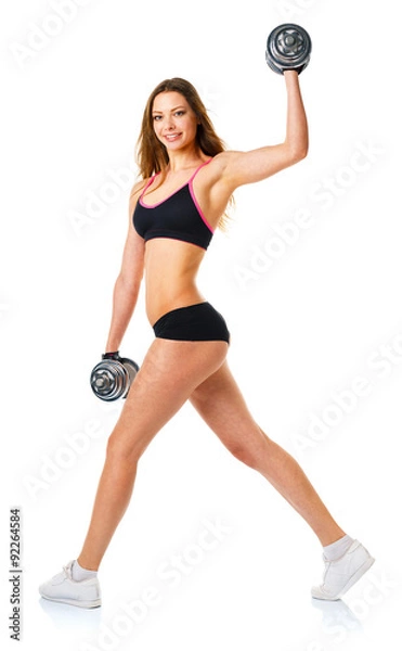 Fototapeta Happy athletic woman with dumbbells doing sport exercise, isolat