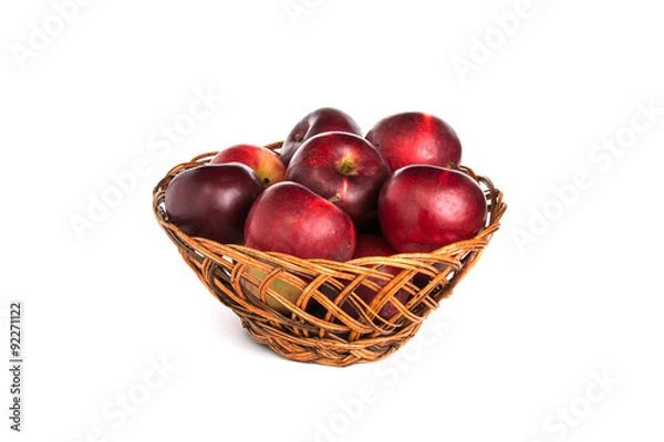 Obraz Яблоки в корзине на белом фоне