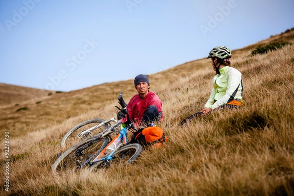 Fototapeta Biker riding in autumn mountains