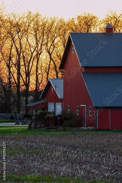 Obraz A red barn on a farm at sunset