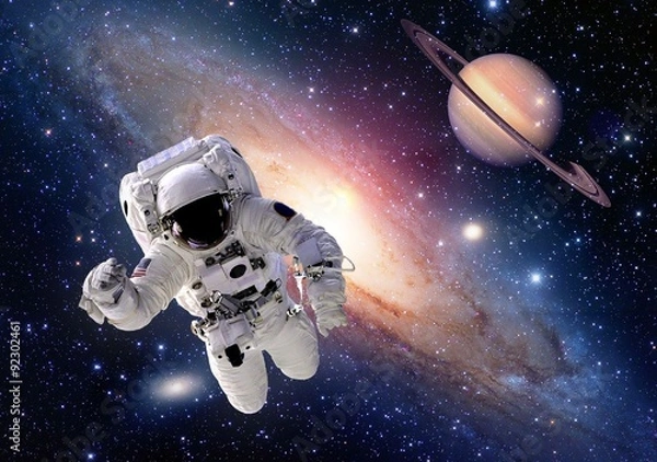 Fototapeta Astronauta kosmonauta w kosmosie Saturn Planet People Universe. Elementy tego zdjęcia dostarczone przez NASA.