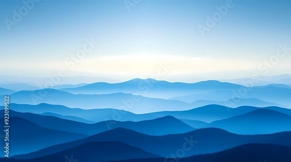 Fototapeta A beautiful blue mountainscape with a hazy sky in the background.