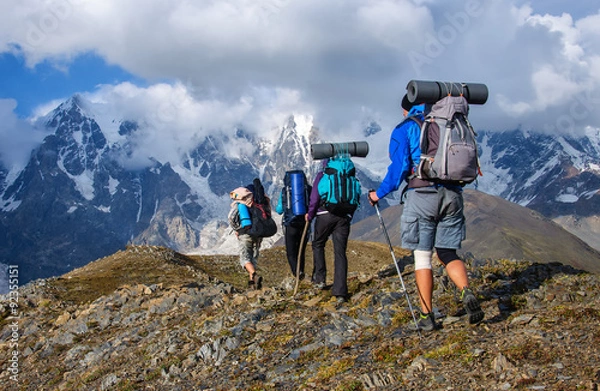 Obraz Group of tourists with large backpacks are on mountain
