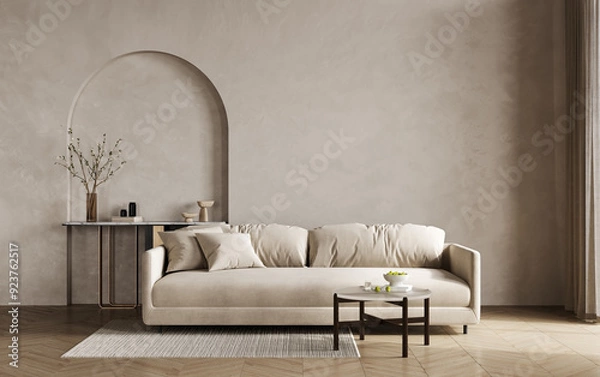 Fototapeta Stylish living room in warm natural colors. Brown beige walls, light lounge furniture -sofa, table and arch. Empty background microcement. Mockup room office reception. 3d rendering
