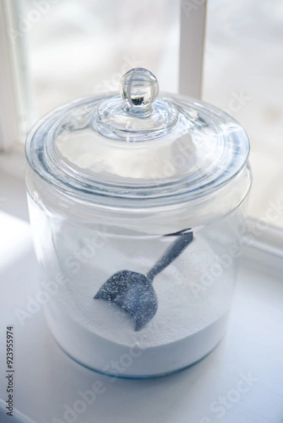 Obraz Glass jar containing washing soap on a shelf in the Laundry room 