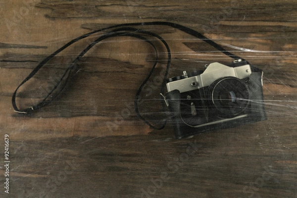 Fototapeta Retro photo camera on wooden background