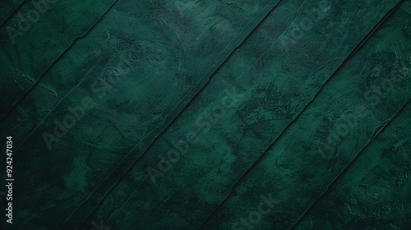 Fototapeta A textured dark green background with diagonal lines, suitable for various graphic design purposes.