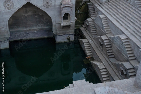 Fototapeta Toorji's Step Well, Toorji ki Jhalara, Toorj ki jhalra, was built in 1740s.Hand carved step well bulit to provide water to the local people in the desert. Ancient architecture Jodhpur,Rajasthan,India.