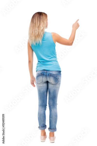 Obraz Back view of  pointing woman.