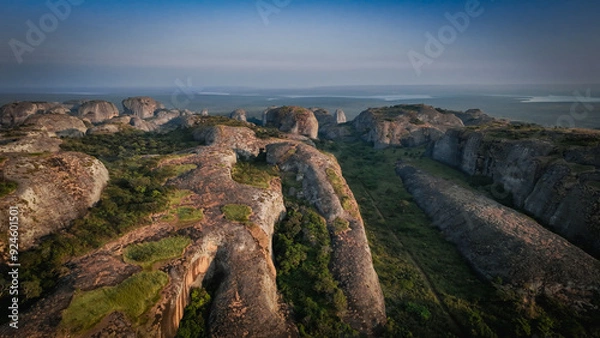 Fototapeta View of the Pedras Negras Mountains in Angola showcasing unique rock formations and lush vegetation during daylight