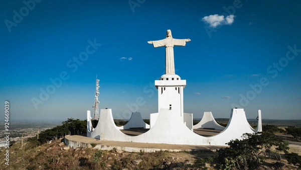Fototapeta Statue of Christ overlooking Lubango, Angola during a clear day