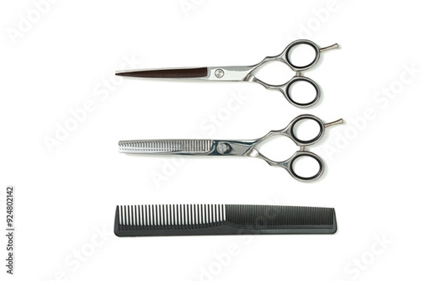 Obraz Set of Professional haircutting scissors of high-quality stainless steel with sharp blades and ergonomic finger holes for easy handling for barbers to trim the hair in a salon, on white background