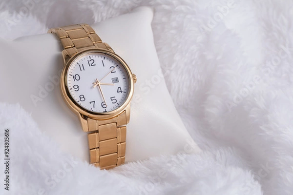 Obraz Gold luxury wristwatch, Made of a gold-toned metal on a white background with depth of field. Close-up