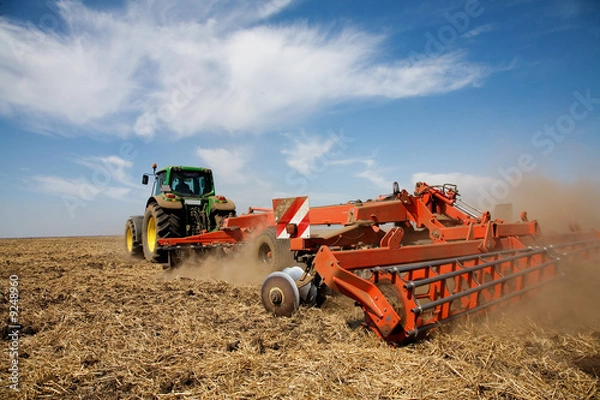 Fototapeta Tractor at work on farm, general rural scene