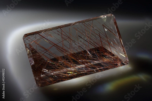 Fototapeta Quartz with rutile. Cut stone.