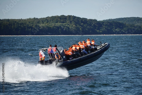 Obraz A motor boat sails fast on the Baltic Sea