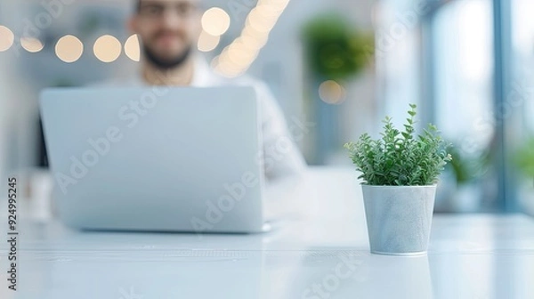 Obraz Man Focused on Laptop in Office/Cafe Setting