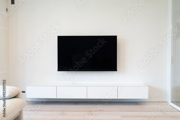 Fototapeta リビングのソファーとフロートテレビボード、壁掛けテレビの工事前と後