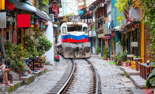 Obraz Hanoi city railway Perspective view running along narrow street with houses in Vietnam