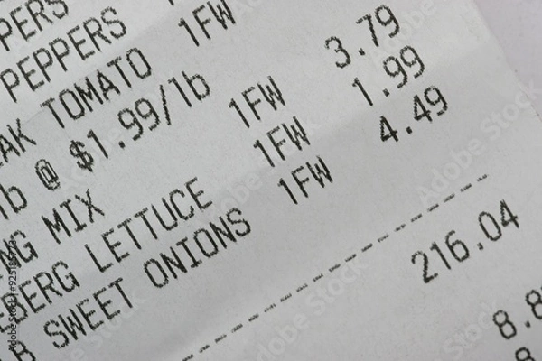 Fototapeta Macro photo of a grocery receipt for produce in the amount of $216.04