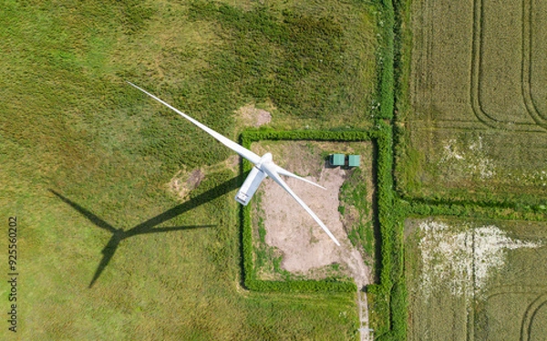 Obraz top down birds eye aerial view of a wind turbine in a small rural wind farm in the English countryside