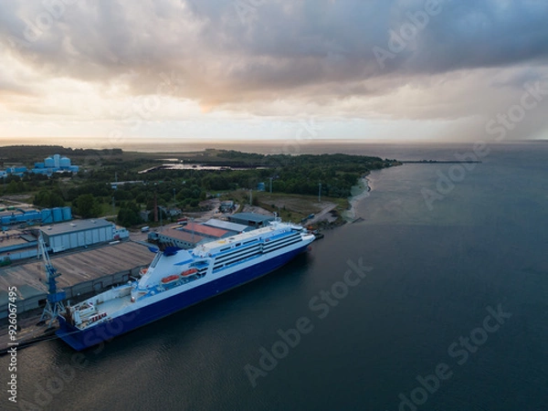 Fototapeta A passenger ship in the repair port at Kopli in Tallinn during an approaching storm, photo view from a drone.