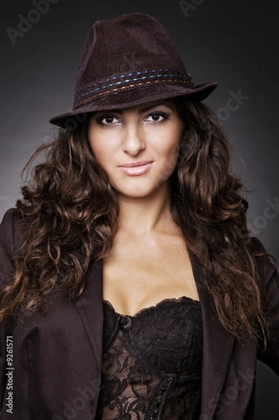 Fototapeta smiley woman in hat over dark background