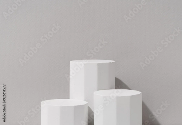 Obraz Minimalist Product Presentation Display with Three Geometric White Pedestals on Gray Background